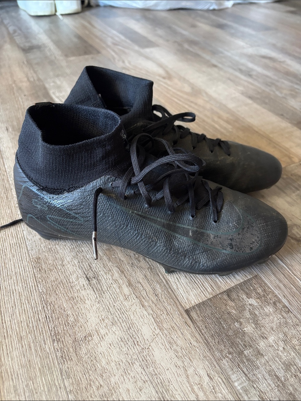 Nike Men’s Black High-Top Soccer Cleats with Subtle Teal Accents